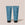 Acure Daily Workout shampoo and conditioner tubes on a beige background